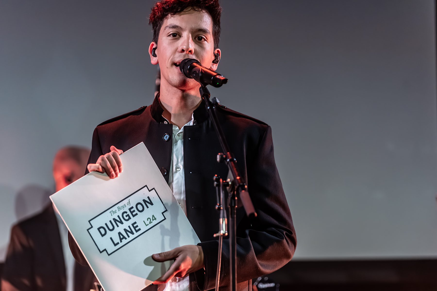 Thomas holding The Boys of Dungeon Lane record